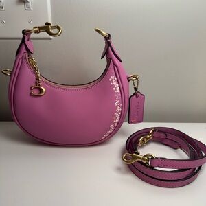 Coach jonie bag in fuschia with cherry blossom floral pattern